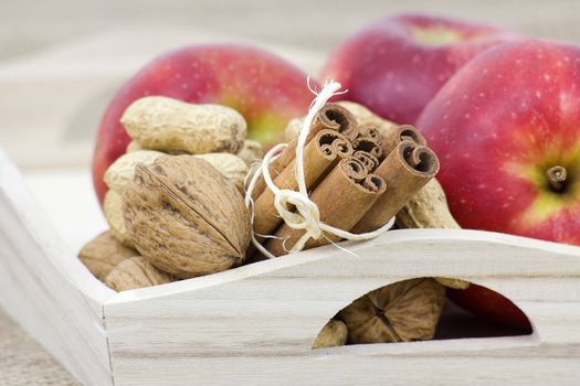 cinnamon sticks, apples and nuts