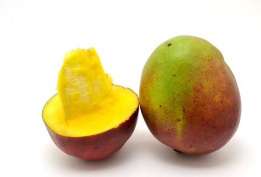Two mangos over the white background