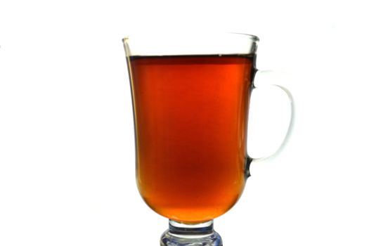 The glass cup of tea over white background