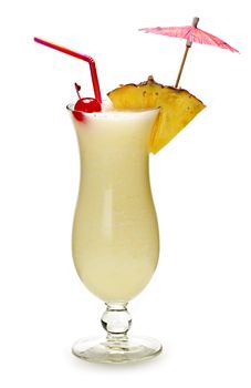 Pina colada drink in hurricane cocktail glass isolated on white background