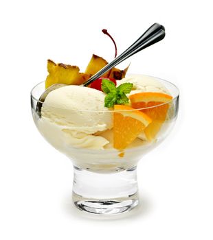 Dish of ice cream and fruit isolated on white background