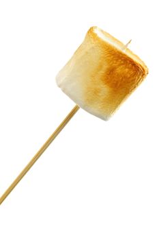 Golden toasted marshmallow on a wooden skewer