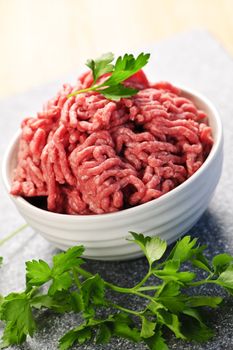 Close up on bowl of lean red raw ground meat