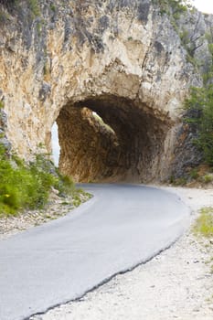 Narrow mountains tunnel in Durmitor, Montenegro, Balkans.