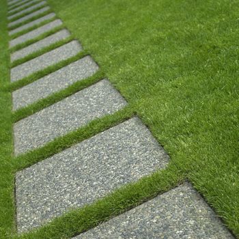 Manicured grass and stone tiles