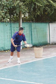 Thai boy tennis practicing