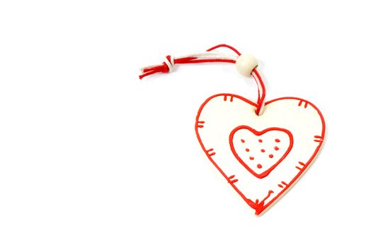 wooden heart on Christmas tree on white background