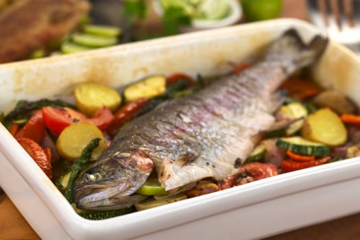 Baked trout and vegetables (Selective Focus, Focus on the eye of the fish)