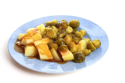 Brussels sprouts in a studio setting over white