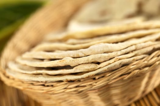 Indian flatbread called chapati in basket (Selective Focus, Focus on the front edge of the first three chapati)