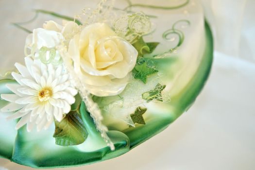 Detail view of a beautiful wedding cage with marzipan roses