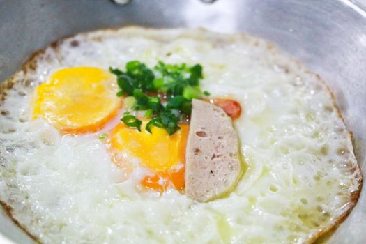 fried egg stuff with hot pan was served in the morning