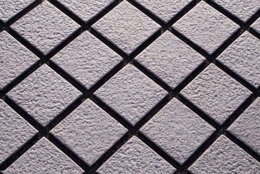 Close up of diamond shaped stone street tiles