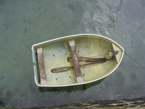 A small rowing boat in a Cornish harbour