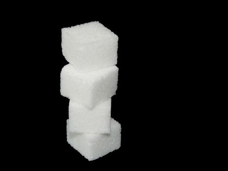 Sugar cube on black background