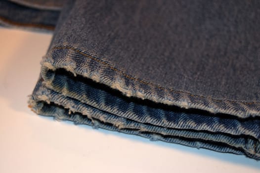 a pair of old,worn blue jeans