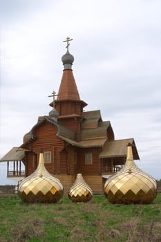 Three golden dome on the ground with green grass