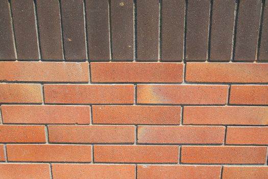 Close up of a brickwall showing unique pattern.
