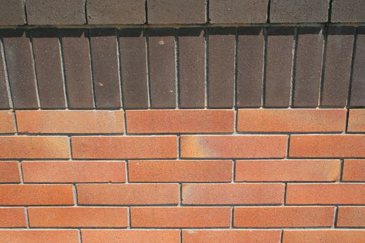 Close up of a brickwall showing unique pattern.
