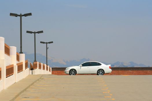 White Lexus GS with chrome rims and tinted windows.
