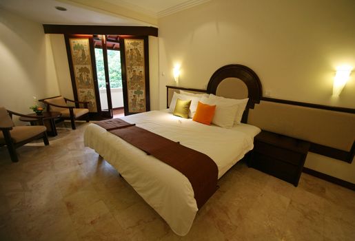 Nice bedroom with the big bed. Hotel Kartika. Bali