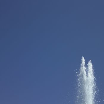 Fountain in the blue sky