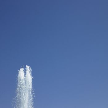 Fountain in the blue sky