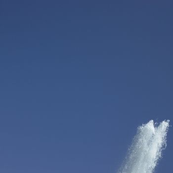 Fountain in the blue sky