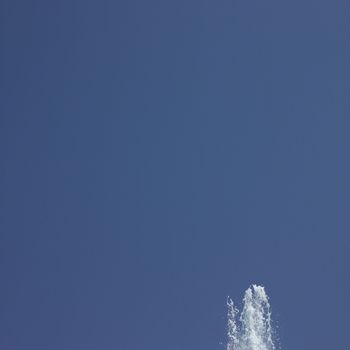 Fountain in the blue sky