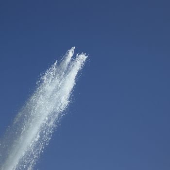 Fountain in the blue sky