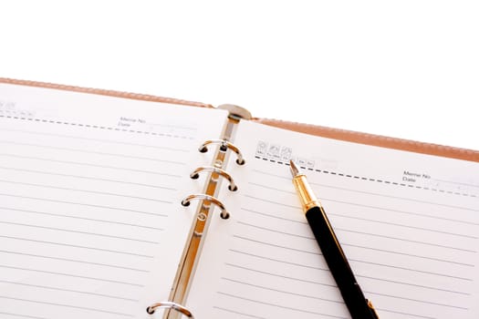 Notebook and pen isolated on white background