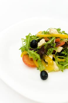 fresh Greek salad on white plate