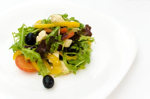 fresh Greek salad on white plate