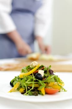 fresh Greek salad on white plate, cook on background