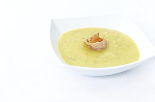 Broccoli cream soup in white plate