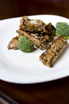 baked pork ribs on a white plate