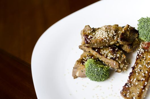 baked pork ribs on a white plate