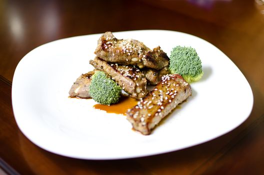 baked pork ribs on a white plate