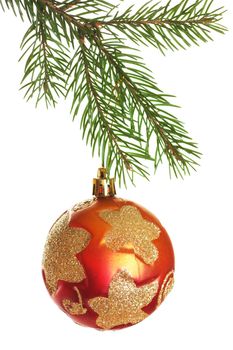 Christmas ball on fir branch isolated over white background
