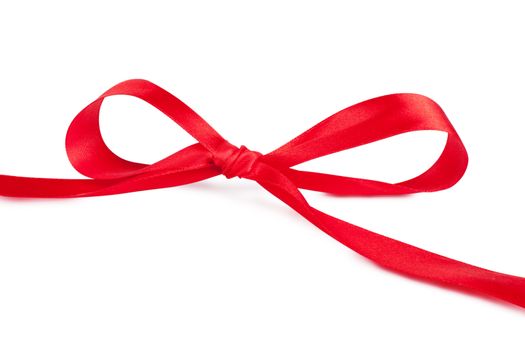 Red bow, red silk ribbon over white background