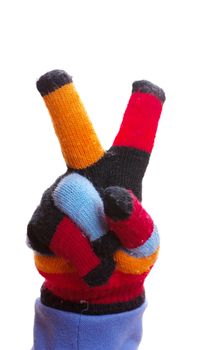 Childs hand in glove with two fingers victory gesture