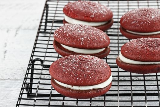 Red velvet whoopie pies or moon pies. Shallow depth of field.