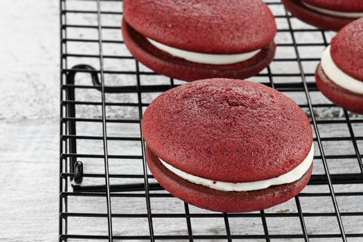 Red velvet whoopie pies or moon pies. Shallow depth of field.