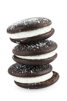 Stack of whoopie pies or moon pies isolated on a white background with light shadow. Clipping path included.