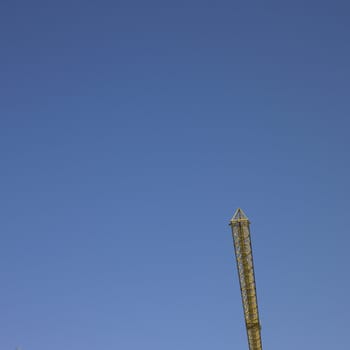 yellow construction crane and blue sky