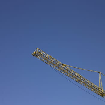 yellow construction crane and blue sky