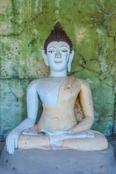 Abandoned Lord Buddha statue in Paa Jareon Tham temple, Chiangmai, Thailand