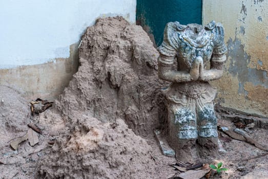 Abandoned headless male deity who protects religious at Paa Jareon Tham temple, Chiangmai, Thailand