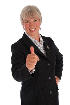 Senior business woman giving the thumbs up on white.