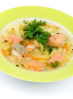 Green Plate of Fish Soup with Salmon, Cod, Trout, Potato, Carrot decorated with Dill and Parsley closeup on white background